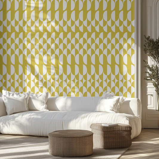 Living room with white sofa, decorative pillows, and yellow geometric patterned wallpaper.