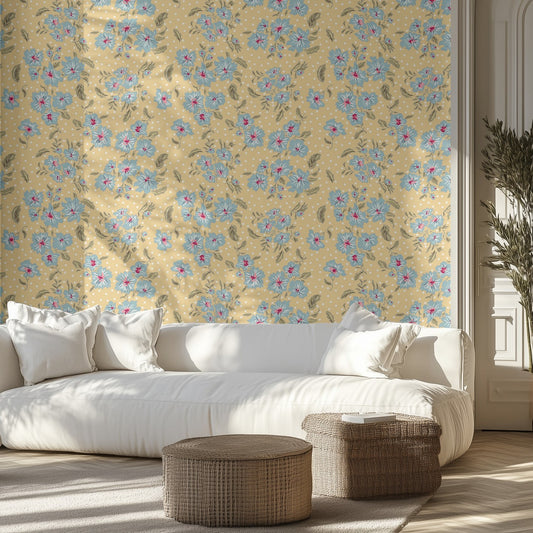 Living room with blue floral on yellow background wallpaper, white sofa, and wicker ottomans.