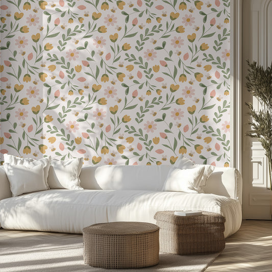 Modern living room with a white sofa, spring floral patterned wall, and wicker ottomans.