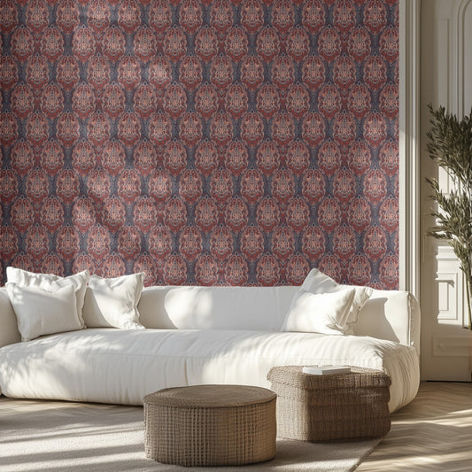 Modern living room with a white sofa, maroon boho patterned wallpaper, and decorative items.