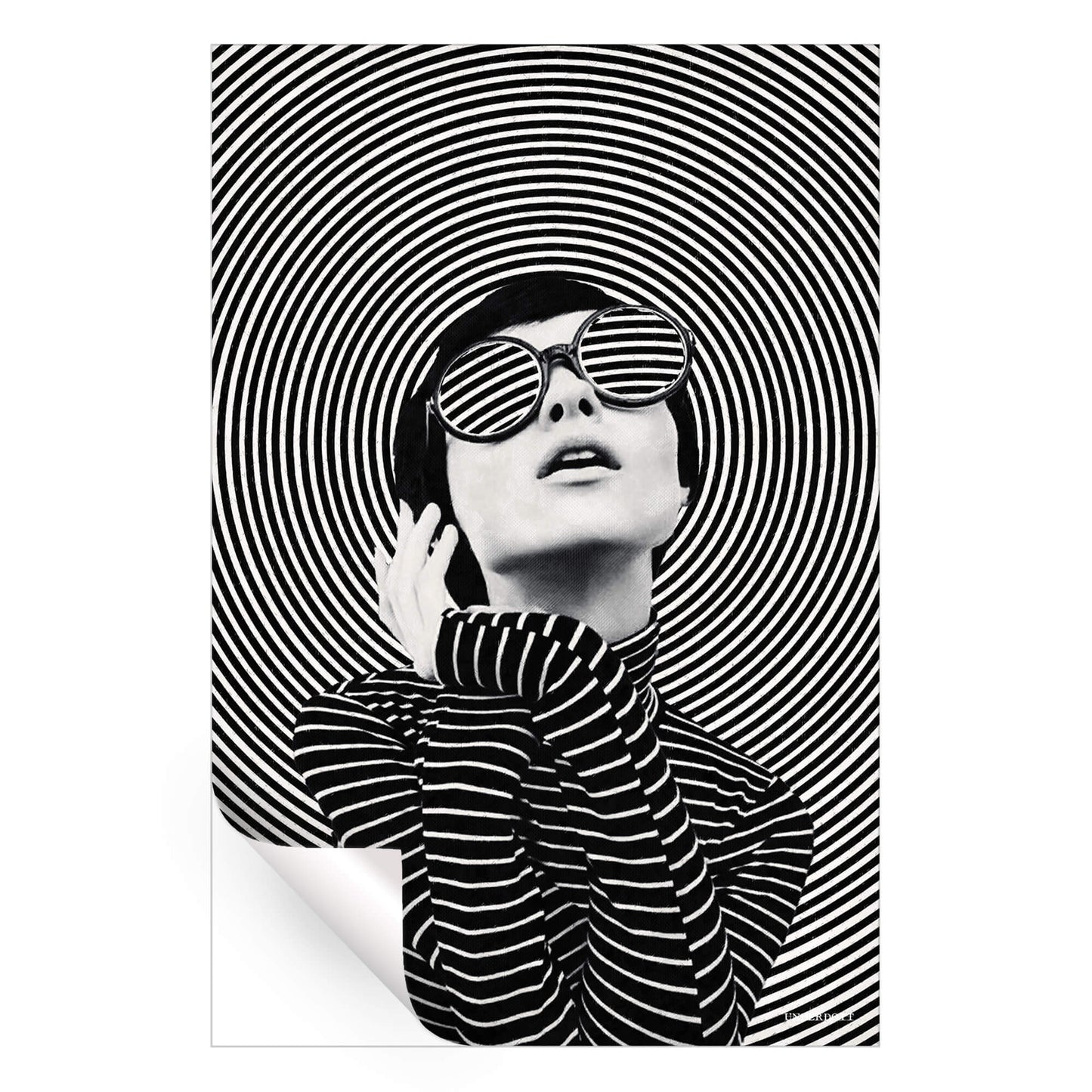 A woman in sunglasses poses in front of concentric black and white circles, creating a dynamic and fashionable artwork.