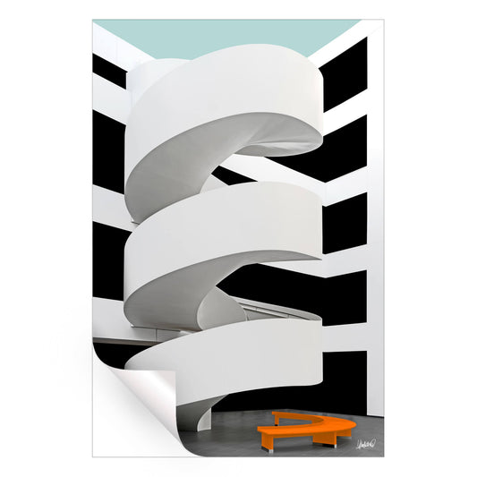 White ramp with black and white background and an orange bench.