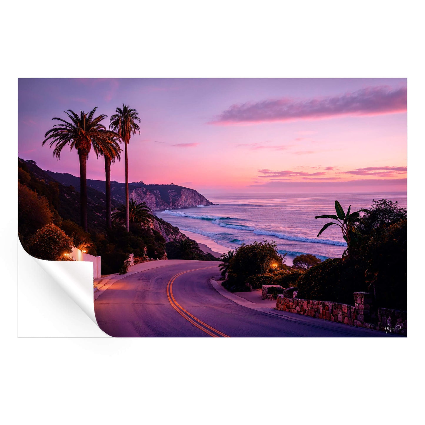 Coastal road at sunset with palm trees, rugged cliffs, and a pink and purple sky.