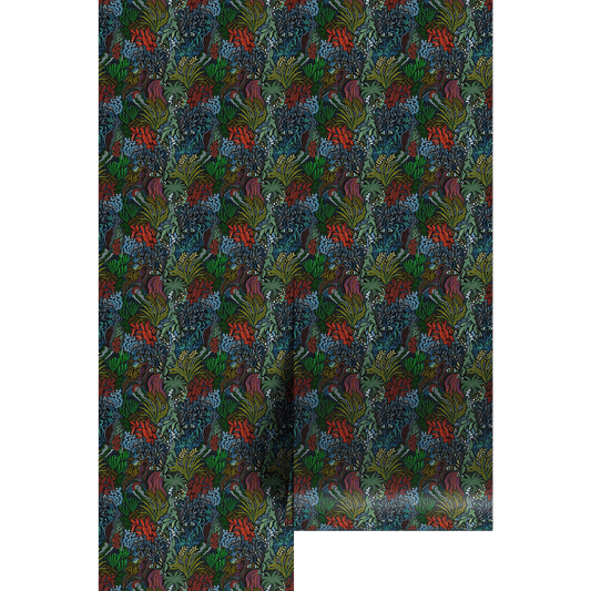 Patterned paper with a green and red botanical design on a dark background