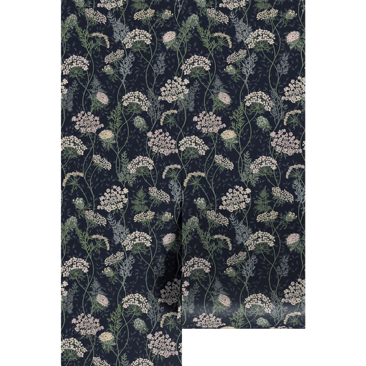 Floral lace patterned paper with white flowers on a dark blue background