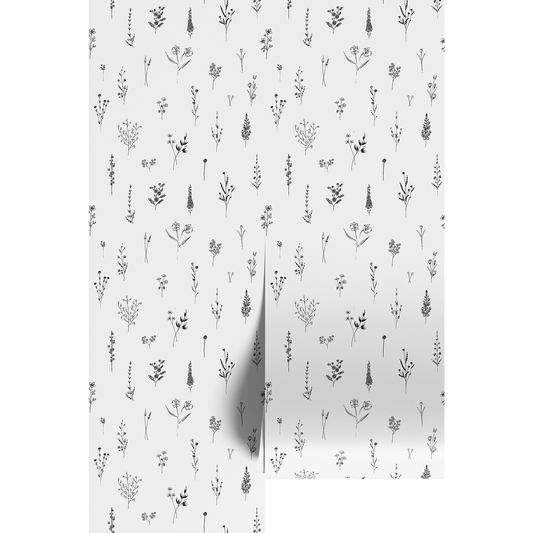 Patterned paper with small black flower illustrations on a white background.