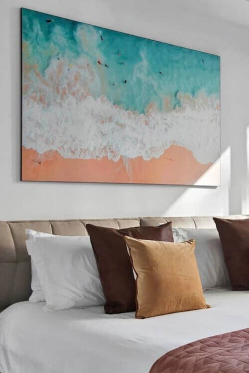 Extra Large Beach Landscape Art Hanging Above Neutral Bed