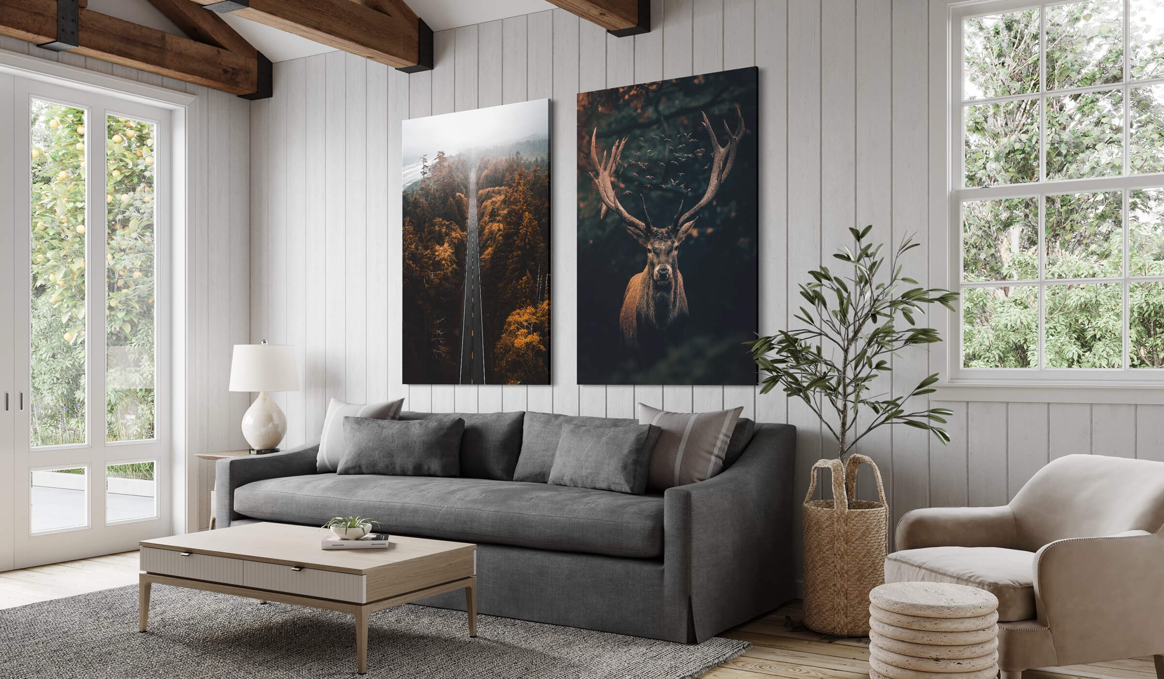 Oversized moody nature artwork featuring aerial photography of woods and a deer hang in farmhouse Airbnb