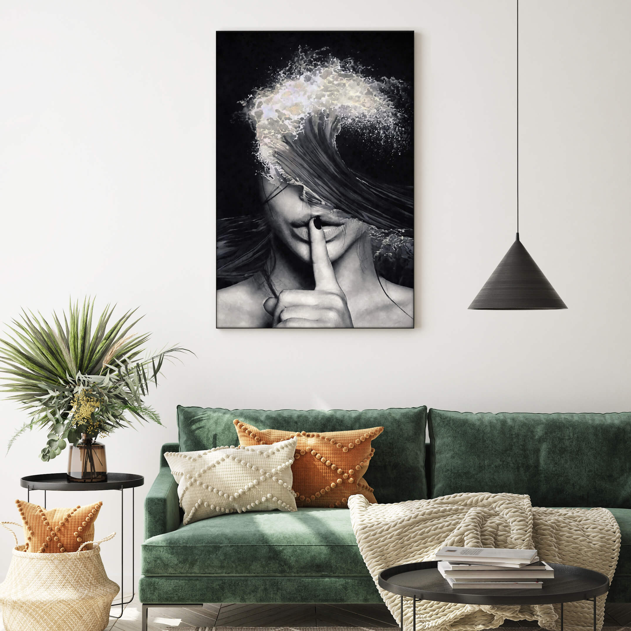 Extra large black and white surreal living room wall art hangs above dark green velvet couch in boho living room.