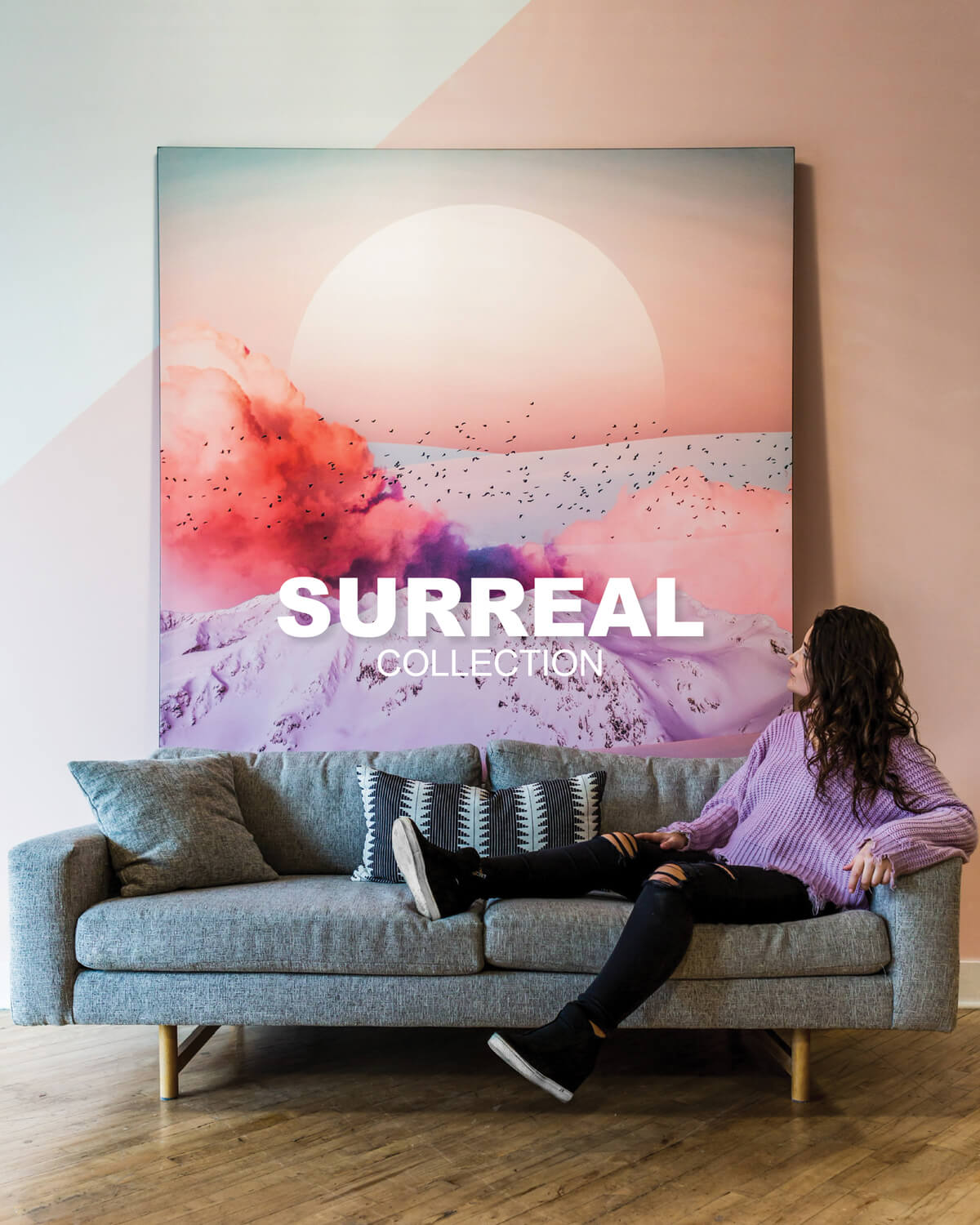 Large Pink Surreal Artwork hung up on the wall behind a couch