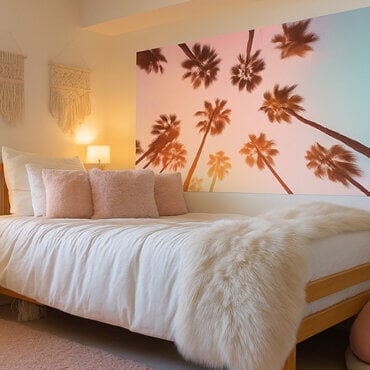 Palm tree dorm room wall art above a bed in a feminine college dorm room