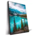 Moraine Lake in Banff National Park, with turquoise waters reflecting peaks and lush pine forests.