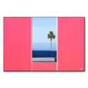 Palm tree framed by pink walls with a blue sea and sky background, creating a serene scene.