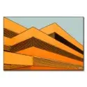 Vibrant building facade with orange panels and black slats in a pattern against a gray-blue background.