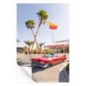 Red convertible parked in front of an In-N-Out Burger with palm trees and a clear sky.