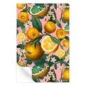 Vibrant botanical artwork featuring ripe oranges, citrus slices, and delicate blossoms against a soft pink background.