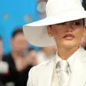 Zendaya wearing a white tailored Louis Vuitton suit and oversized hat at the 2025 Met Gala