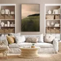 Large landscape photography art work hangs in a white beachy coastal modern room
