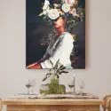 Massive surreal flower head wall art hangs in kitchen above dinning room table.