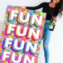 This vibrant and playful "Fun Fun Fun" print by Jessica Stempel. The maximalist wall art features a girl holding a champagne bottle in one hand and the colorful print in the other. The "FUN FUN FUN FUN" text is displayed in a retro bubble font with rainbow dots stamped in the background, creating a fun and playful vibe. This piece is perfect for adding a touch of personality to your maximalist bedroom and will bring a lively energy to your space.