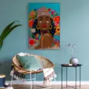 a blue wall featuring a pop art piece of a black woman