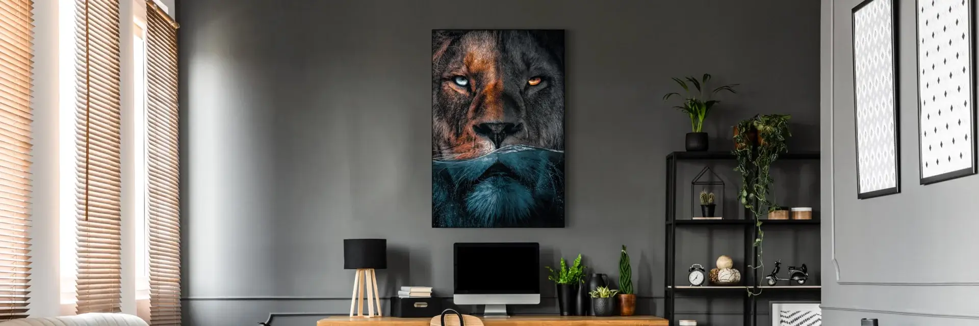Large lion photo showing lion's face halfway underwater hangs on grey wall in home office.