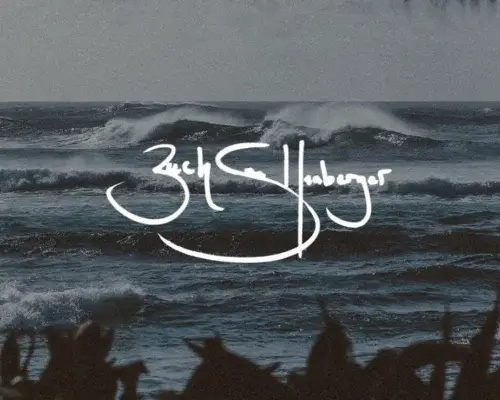 Vintage photography style of waves crashing in Hawaii with photographer Zach Snellenberger signature in white