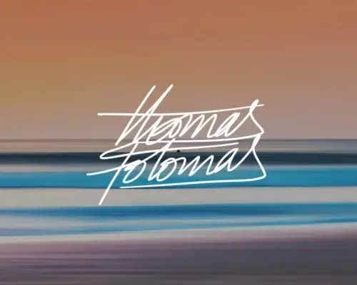 Abstract digital art in orange and blue of the sunset with artist Thomas Fotomas signature in white