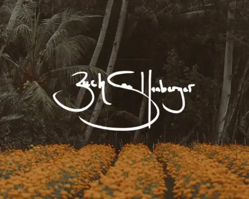 Orange field of flowers in front of tropical forest with Zach Snellenberger Signature in White