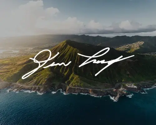 Aerial photo of Hawaiian Island with photographer Devon Loerop signature in white