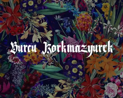 Colorful flower wall art with artist Burcu Korkmazurek signature in white