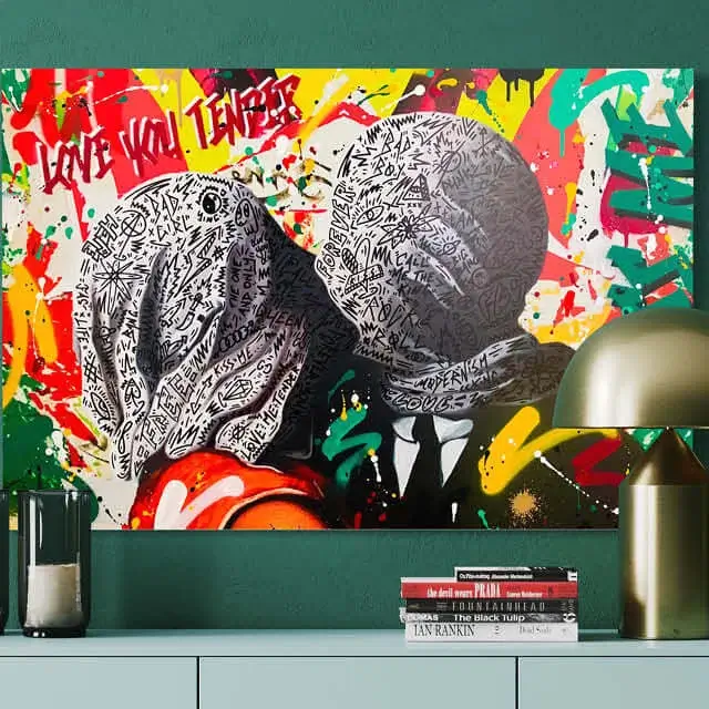stylish graffiti art on a green wall above a desk