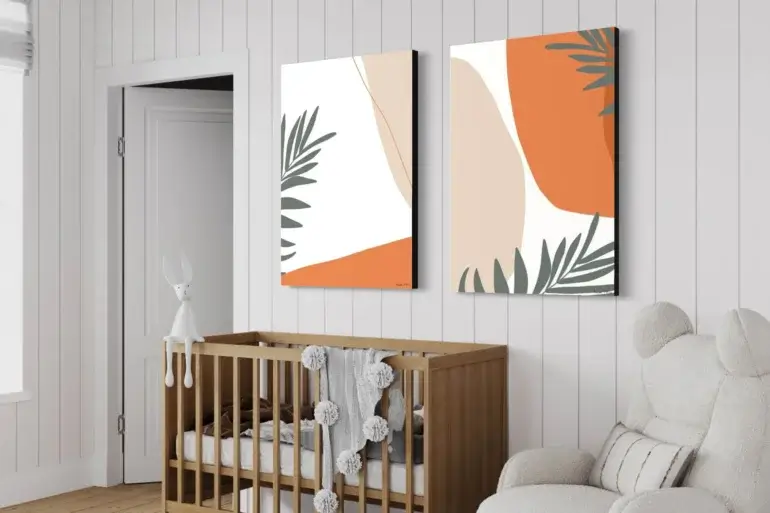 Huge flower minimal artwork with orange and tan spheres and green fronds hangs on white paneled walls above wooden crib in modern nursery.