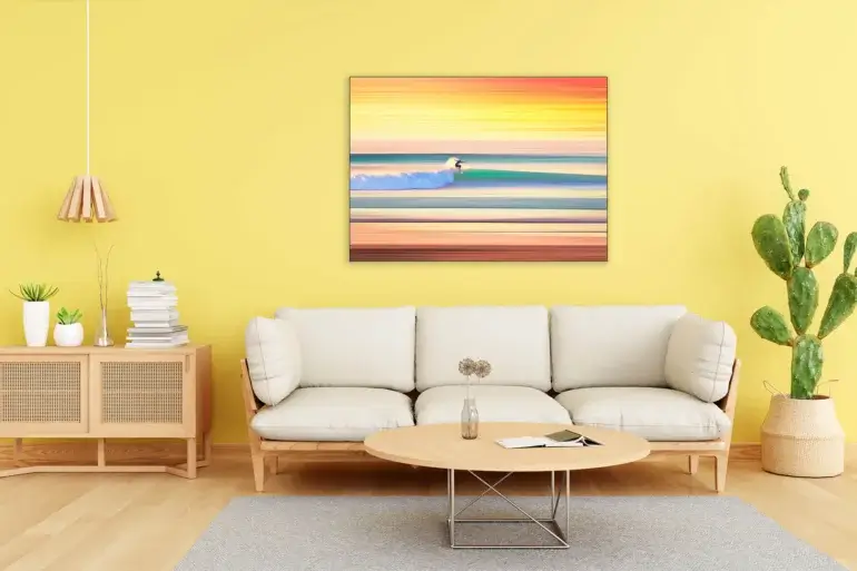 Large contemporary surfing wall art hangs in bright yellow living room