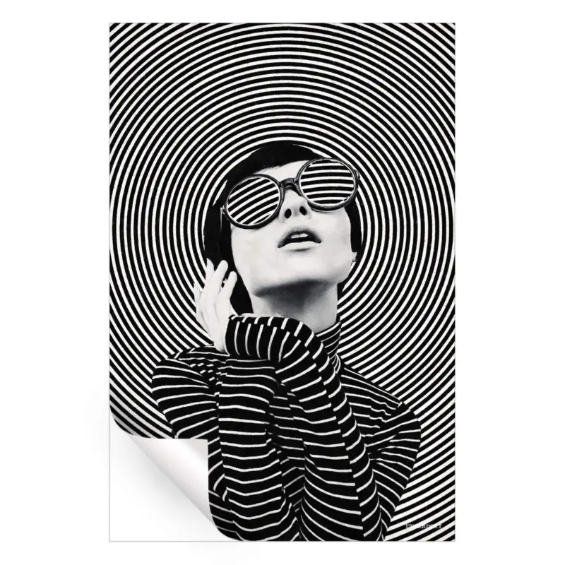 A woman in sunglasses poses in front of concentric black and white circles, creating a dynamic and fashionable artwork.