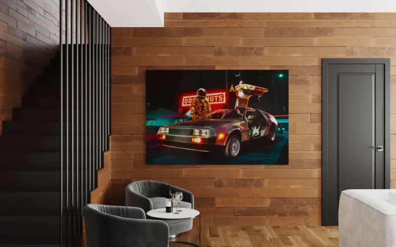 Oversized horizontal surreal wall art featuring an astronaut standing behind retro car hangs on wood paneled wall
