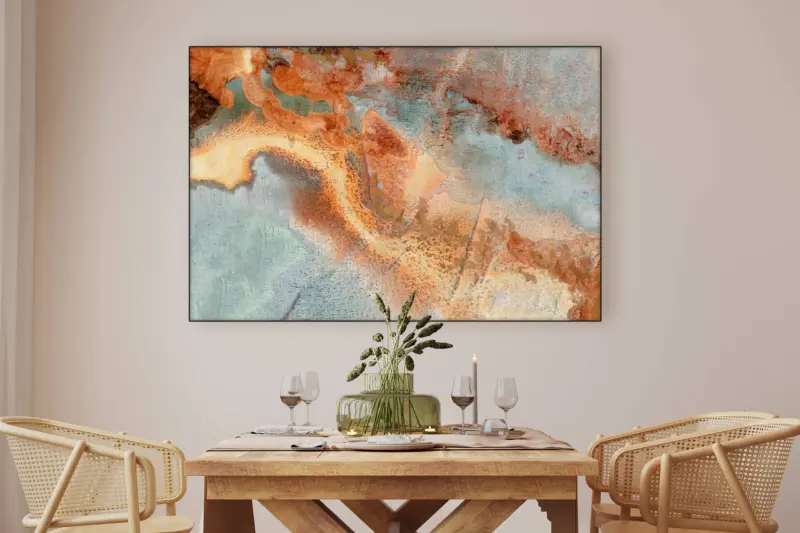Neutral blue and tan abstract geo formation wall art hangs in dinning room above kitchen table.