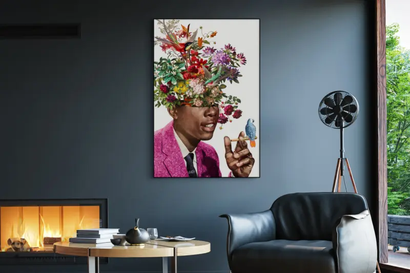 Weed art of a Black man smoking a joint with a colorful wildflowers instead of his head hangs on a blue wall in a man's office decorated in an eclectic vintage style.